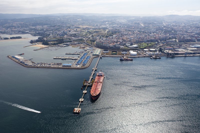Long-aerial-view-of-oil-tanker-in-port-with-city-behind-186667829_1255x837.jpeg